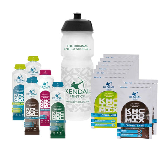 A collection of sports nutrition products from Kendal Mint Co including flavored liquids in packets and a clear water bottle with the brand's logo.